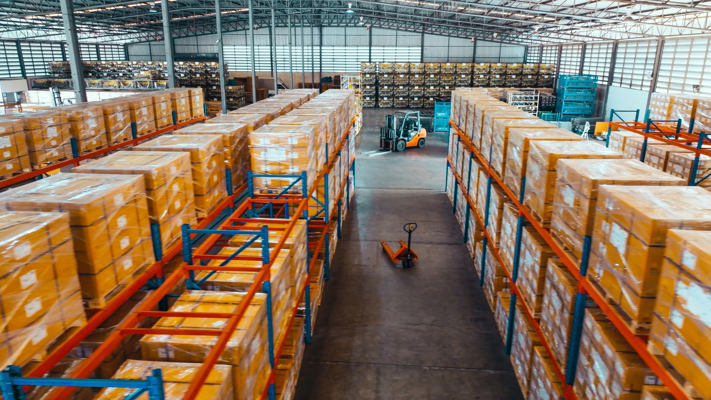 Warehouse shelves with packaged goods in a logistics facility